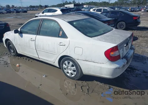 2002 Toyota Camry Le z USA, uszkodzony, nr VIN JTDBE32K620087402